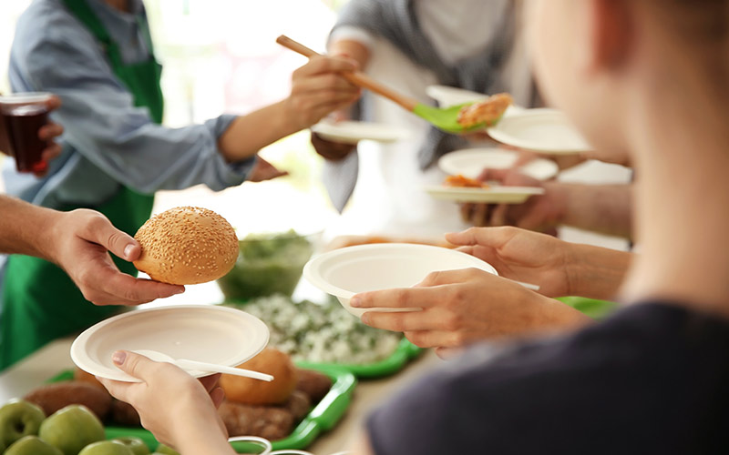 giving food | volunteer at a soup kitchen